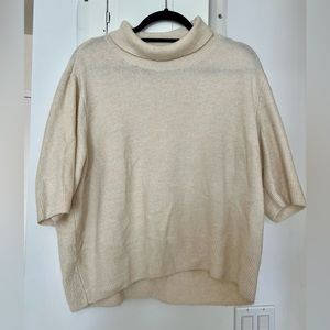 Cream colored mid sleeved turtleneck sweater